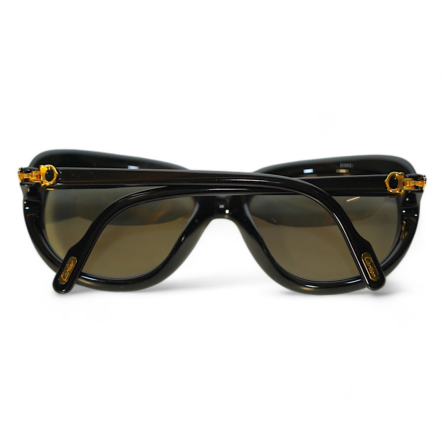 Two pairs of Must de Cartier sunglasses